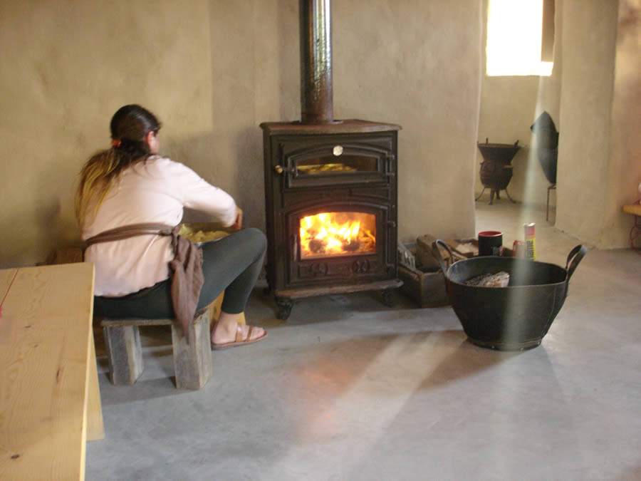 baking tsoureki before Easter in Tenos island in the wood fired stove