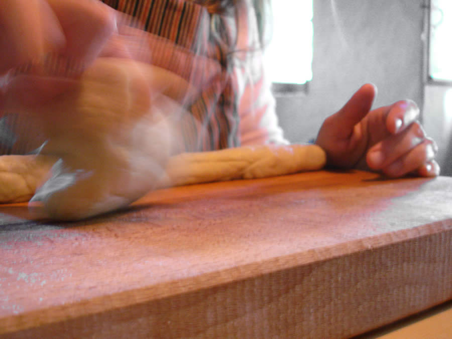kneading tsoureki in Tinos